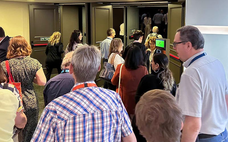 People entering a conference room