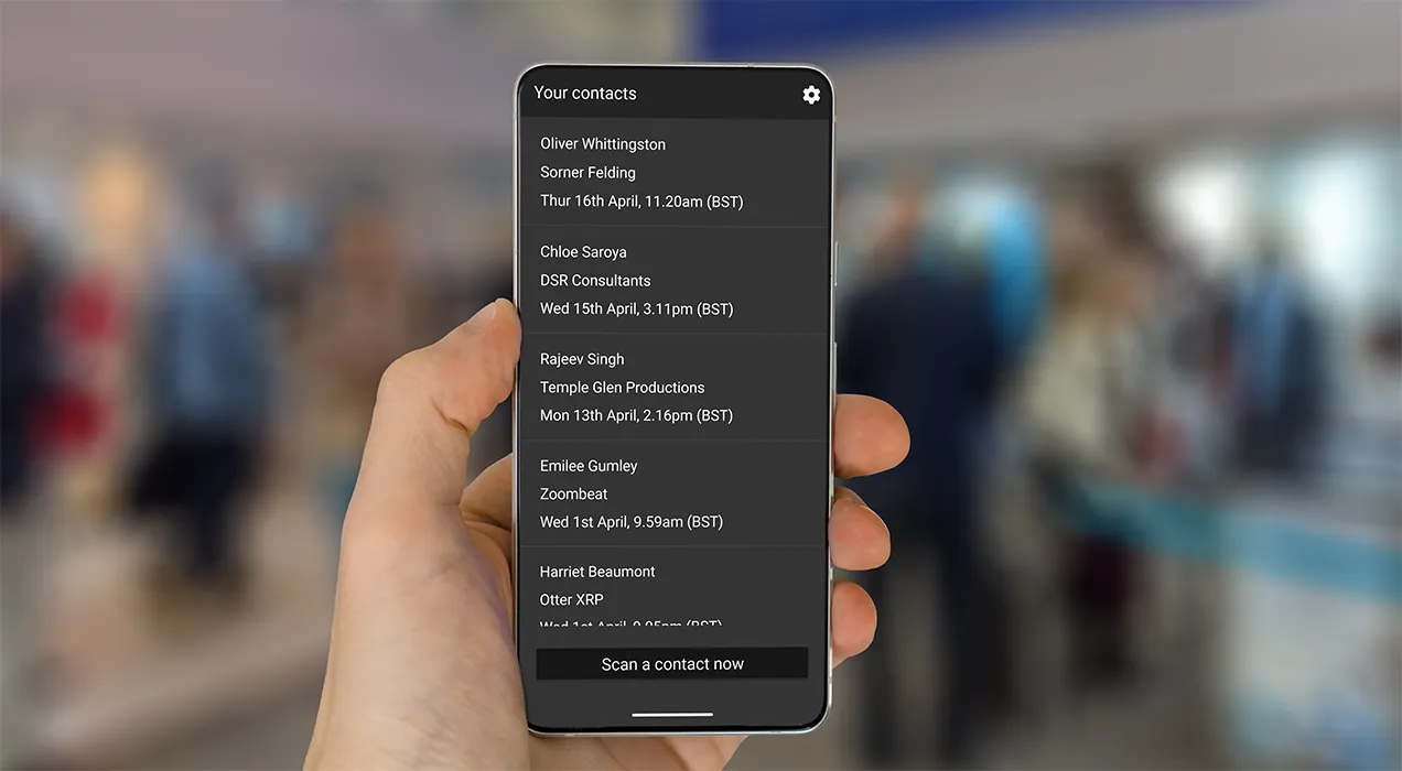 A smartphone displaying the contact details a person has collected from scanning badges through the ContactScanning app.