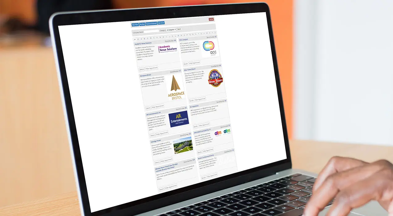 Someone navigating an exhibitor list with descriptions for each exhibitor